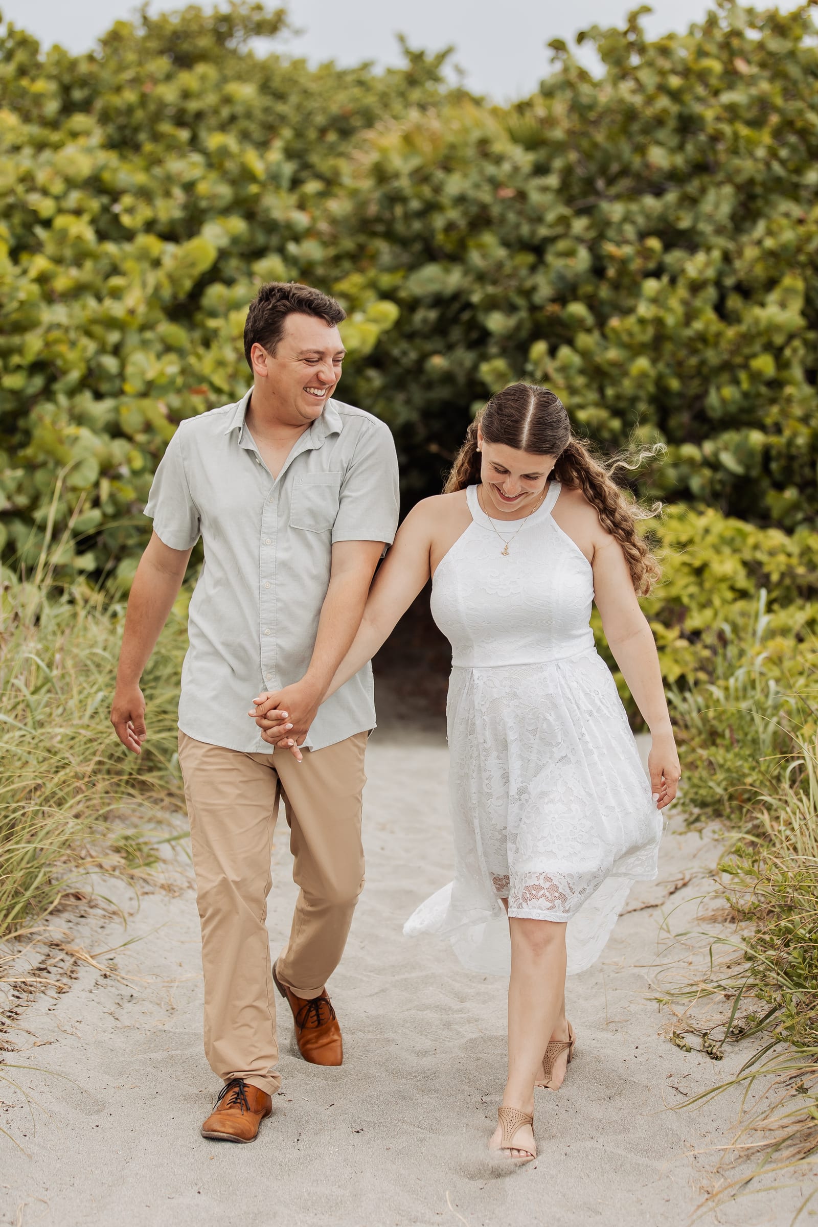 Couple walking the Jupiter Inlet, destination wedding videography across the US and internationally