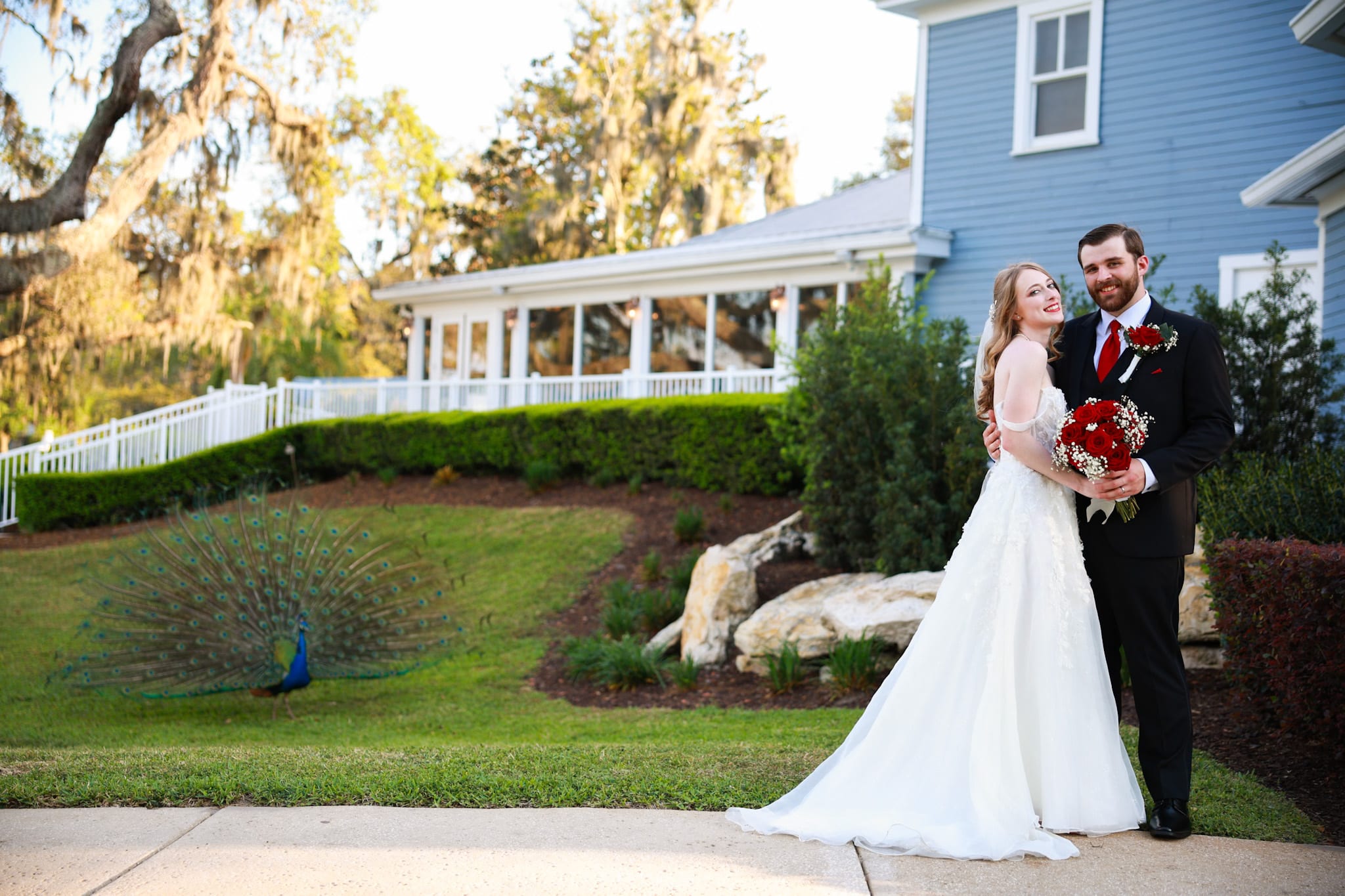 Bride and groom on a grand venue lawn, cinematic Love and Lustre wedding film